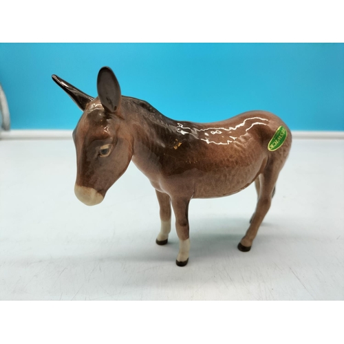 289 - Beswick Figure of a Donkey. 11cm High x 14cm.