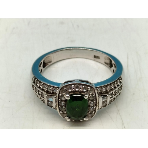 50 - 925 Silver Ring set with Green and Clear Stones. Size R.