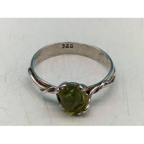 65A - 925 Silver Ring set with Natural Peridot. Size O.