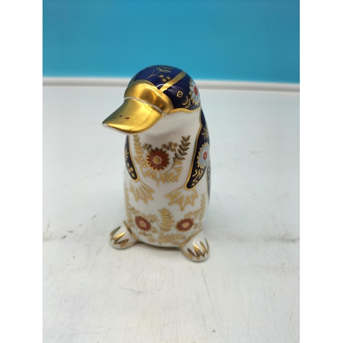 69 - Royal Crown Derby 'Platypus' Paperweight with Silver Stopper. 12cm Tall.