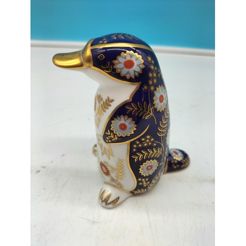 69 - Royal Crown Derby 'Platypus' Paperweight with Silver Stopper. 12cm Tall.