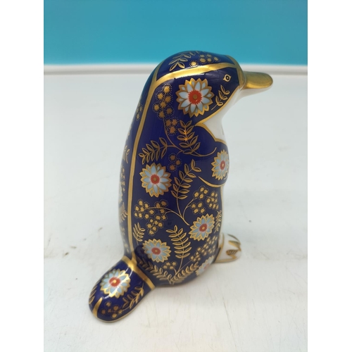 69 - Royal Crown Derby 'Platypus' Paperweight with Silver Stopper. 12cm Tall.