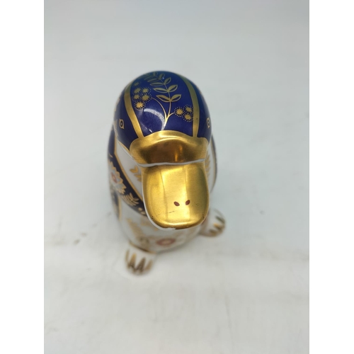 69 - Royal Crown Derby 'Platypus' Paperweight with Silver Stopper. 12cm Tall.