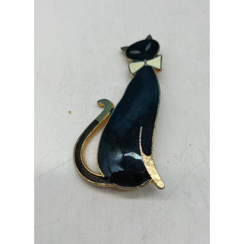 697 - Yellow Metal and Enamelled Black Cat Brooch.