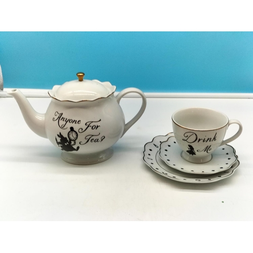 719 - Disney 'Alice in Wonderland' Teapot and Trio.