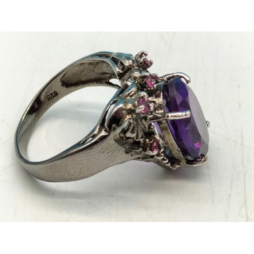 85 - 925 Silver Ring set with Large Purple Stone. Size O.