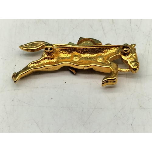 108 - Yellow Metal Jockey on Horse Brooch. 5cm Long.