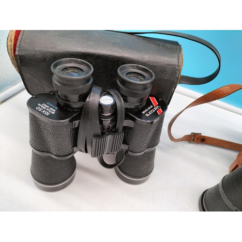 563 - 2 Pairs of Binoculars - Zenith & Ventora.