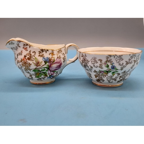 92 - English Bone China Part Coffee Set with a Chintz and Floral Decoration and Gilded Trim. Marked Ferne... 