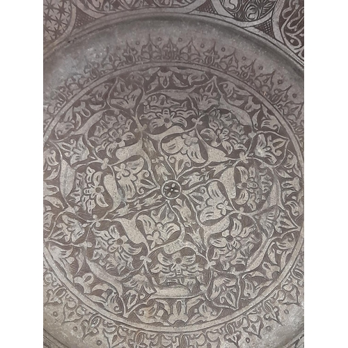 40 - 18th Century Islamic Tinned Copper Charger with Script Decoration. 38cm Diameter.