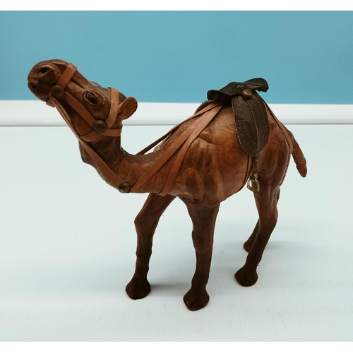 250 - Leather Figure of a Camel. 19cm High x 21cm.