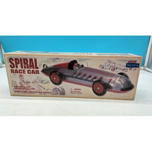 68 - Boxed Tin Plate Spiral Race Car W/O. 32cm Long.