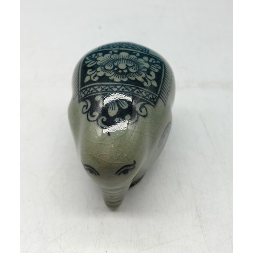 70 - Celadon Glazed Wedding/Celebration Decorated Elephant. 6cm high, 8cm long.