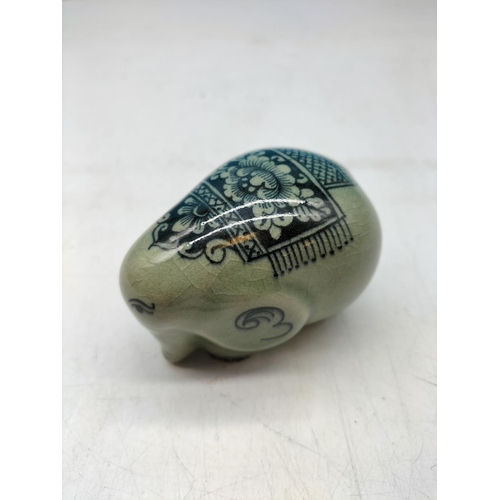 70 - Celadon Glazed Wedding/Celebration Decorated Elephant. 6cm high, 8cm long.