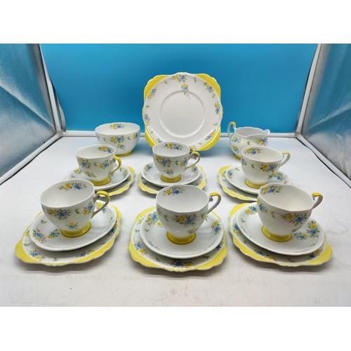 77 - Grafton China 21 Piece Part Tea Set in a Yellow Floral Pattern. 1 Cup A/F, Chip to Rim.
