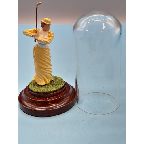 63 - (437) - Figure Of A Lady Golfer Mounted On A Pedestal Inside A Glass Dome, Cold Painted Cast Metal H... 