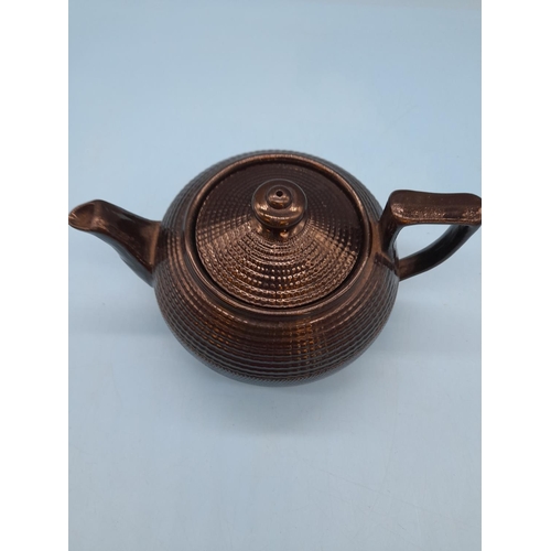 387 - 1960's Black Ceramic Small Teapot. 10cm High, 18cm Long.