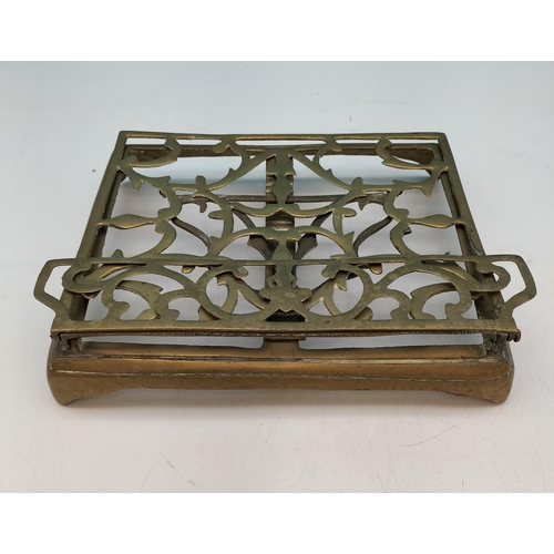 544 - Brass Fold Down Book Holder plus Eagle Door Knocker. Largest 21cm High, 26cm x 24cm.