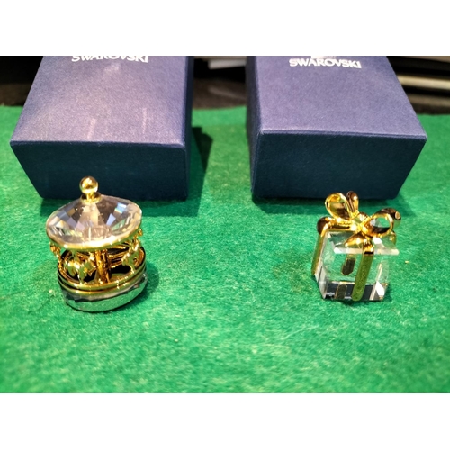 504 - Boxed Swarovski Crystal Ornaments (2) - Carousel and Present.