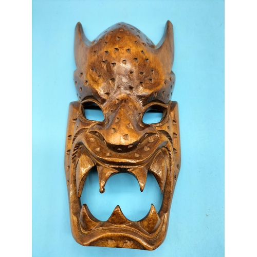499 - Collection of African and Other Craved Wooden Items including Demon Wall Mask, Blow Pipe, etc.