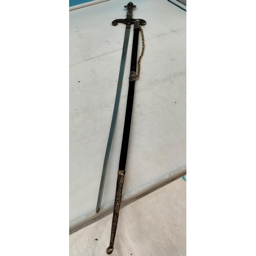 571 - Matching Pair of Medieval Swords plus a Reproduction Brass Handled Sword. Longest 88cm.