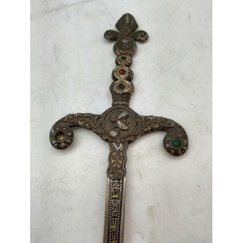 571 - Matching Pair of Medieval Swords plus a Reproduction Brass Handled Sword. Longest 88cm.