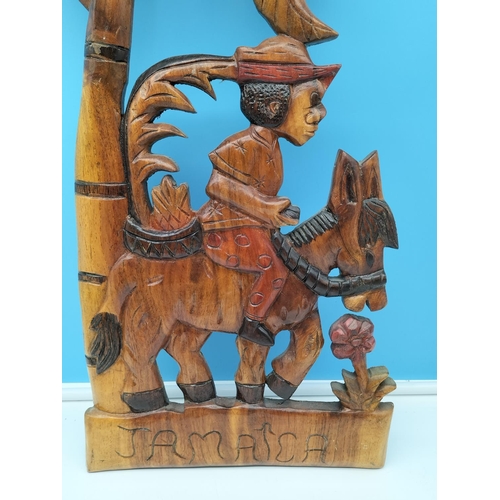 392 - Large Wooden Wall Hanging depicting Boy on Donkey 'Jamaica'. 71cm x 24cm.