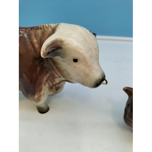 209 - Porcelain Figures of a Bull and a Bison. Largest 14cm High x 23cm.