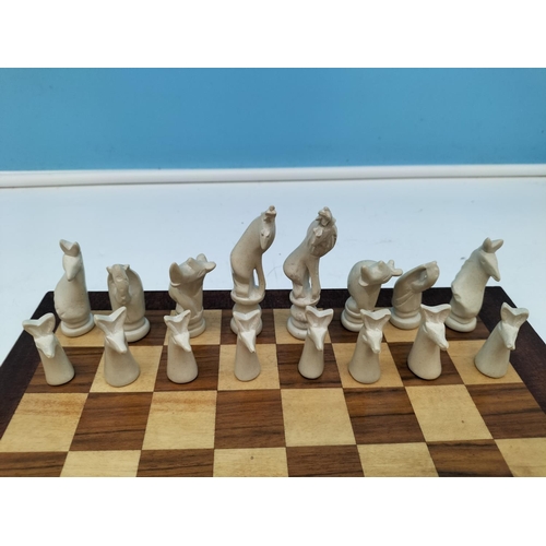 411 - Carved Soapstone African Animals Chess Pieces with Board. Tallest Piece 8cm.