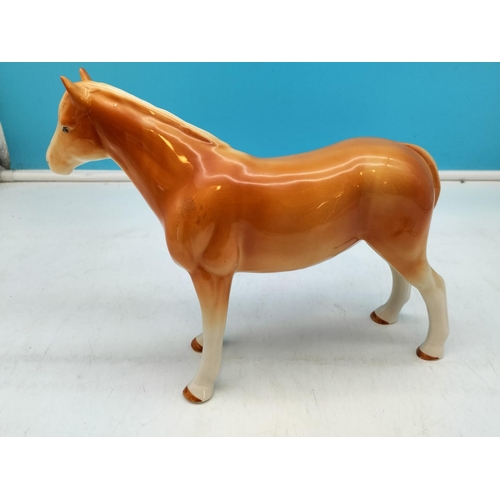 465 - Unmarked Figure of a Palomino Horse. 20cm High x 26cm.