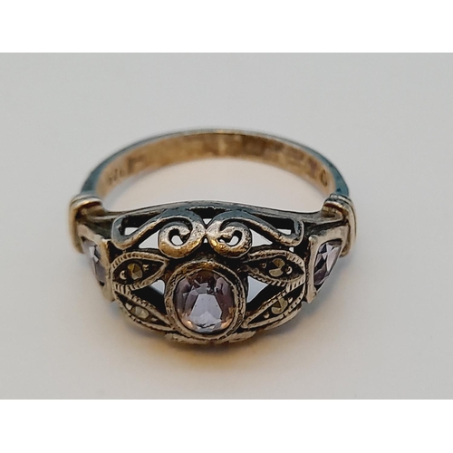 124 - 925 Silver Ring with Amethyst and Marcasite. Size R.