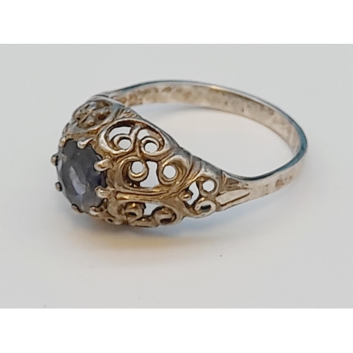 215 - 925 Silver Ring with Blue Stone Centre. Size N.