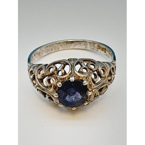 215 - 925 Silver Ring with Blue Stone Centre. Size N.