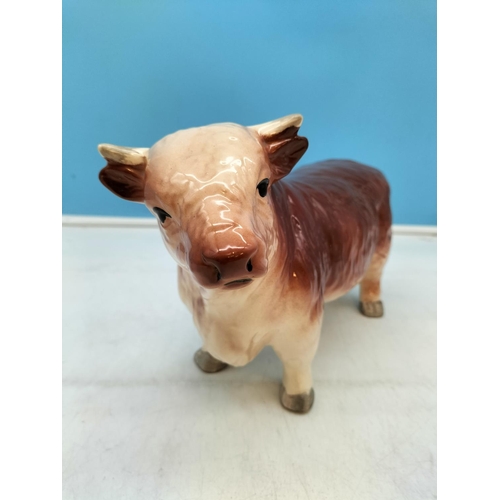 130 - Hand Painted Ceramic Figure of a Bull. Unmarked but Probably Coopercraft. 17cm High x 28cm.