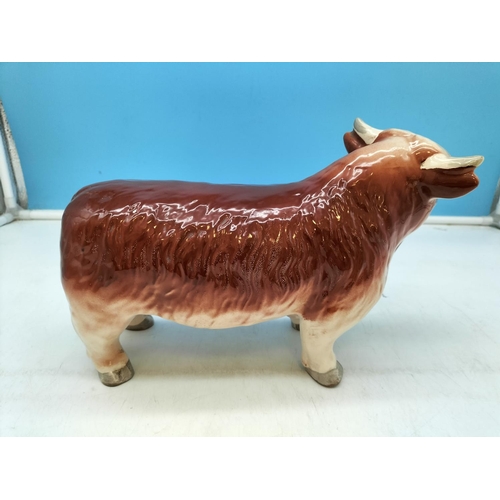 130 - Hand Painted Ceramic Figure of a Bull. Unmarked but Probably Coopercraft. 17cm High x 28cm.