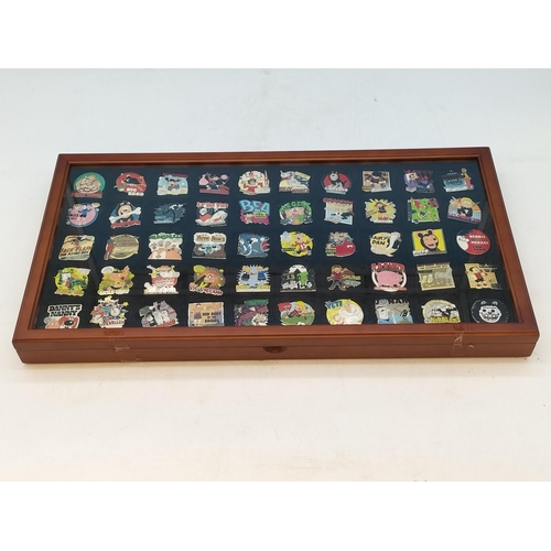 21 - Danbury Mint Collection of Beano Pin Badges in Presentation Case. 48cm x 26cm x 4cm.