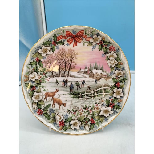 282 - Royal Albert 21.5cm Christmas Plates (2) - 'The Skating Pond' and 'The Coaching Inn'.