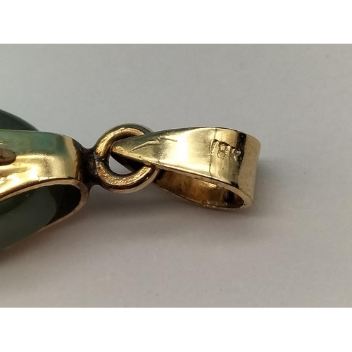 36 - 18ct Gold Shank with Jade Cross 4cm x 2cm.