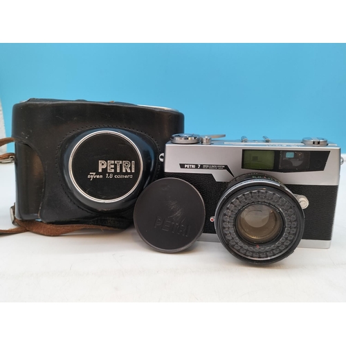 410 - Petri 7 Green-O-Matic System 35mm Camera W/O plus Canon Zoom 518 Super 8 Camcorder with Case.