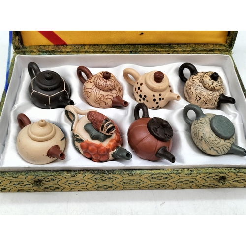 417 - Cased Set of 8 Miniature Chinese Pottery Yixing Teapots.