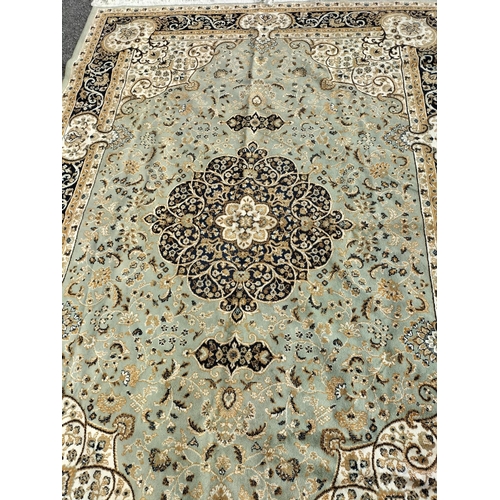 467 - Pale Green Ground Keshan Carpet. 160cm x 230cm.