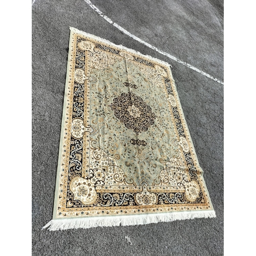 467 - Pale Green Ground Keshan Carpet. 160cm x 230cm.