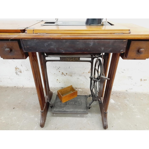 563 - Singer Sewing Machine on Treadle Table. Untested. 118cm x 40cm x 75cm. Collection Only.