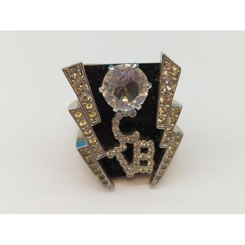 587 - T.C.B. (Taking Care of Business) Elvis Presley Gold Plate and Cubic Zirconia Ring. Size Y.