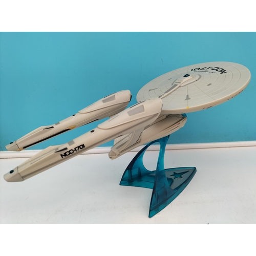 593 - 2009 Playmates Starship USS Enterprise NCC-1701 on Stand. 21cm High, 38cm x 19cm.