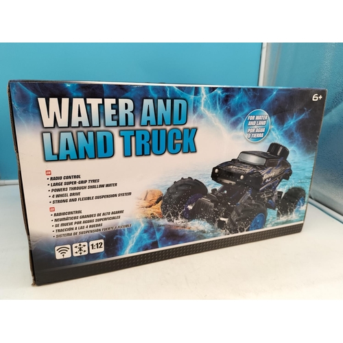 606 - Boxed New 'Water and Land' Remote Control Racing 4 x 4 Truck