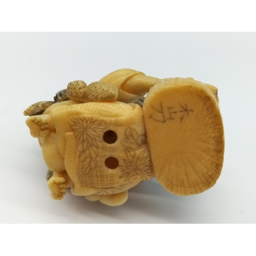 69 - Japanese Netsuke Figure with Character Mark to base. 4cm Long.