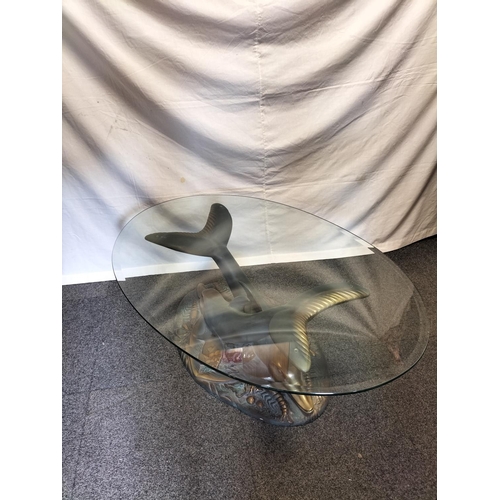 91 - Bevel Edged Glass Top Dolphin Base Table. 41cm High, 114cm x 80cm. Collection Only.