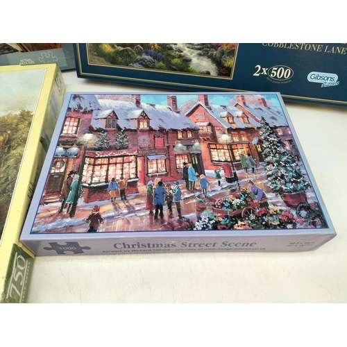 254 - Collection of Jigsaw Puzzles (4) to include a Thomas Kinkade, Christmas Street Scene, The Sweet Shop... 