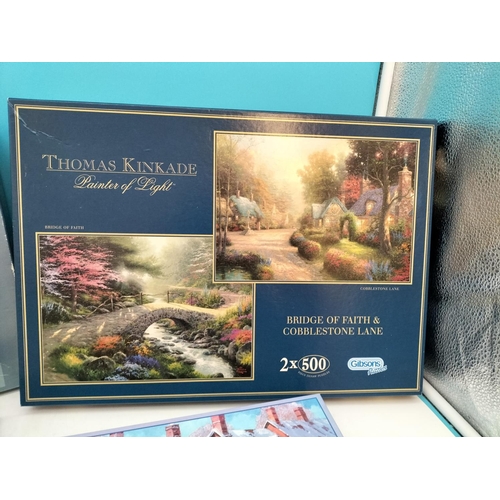 254 - Collection of Jigsaw Puzzles (4) to include a Thomas Kinkade, Christmas Street Scene, The Sweet Shop... 